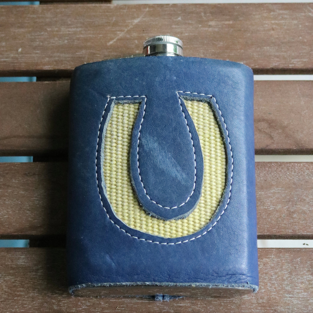 Vintage hose and leather wrapped flask